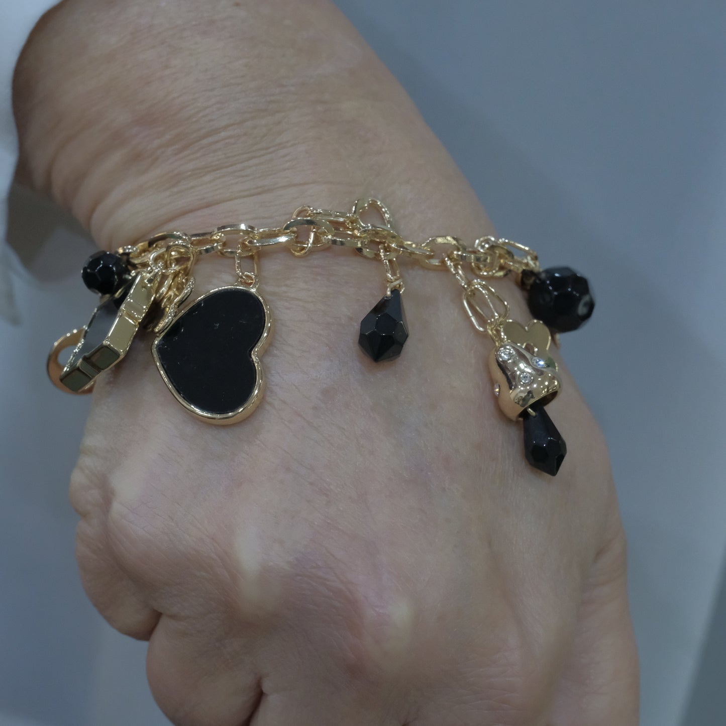 Bracciale in acciaio multi ciondolo